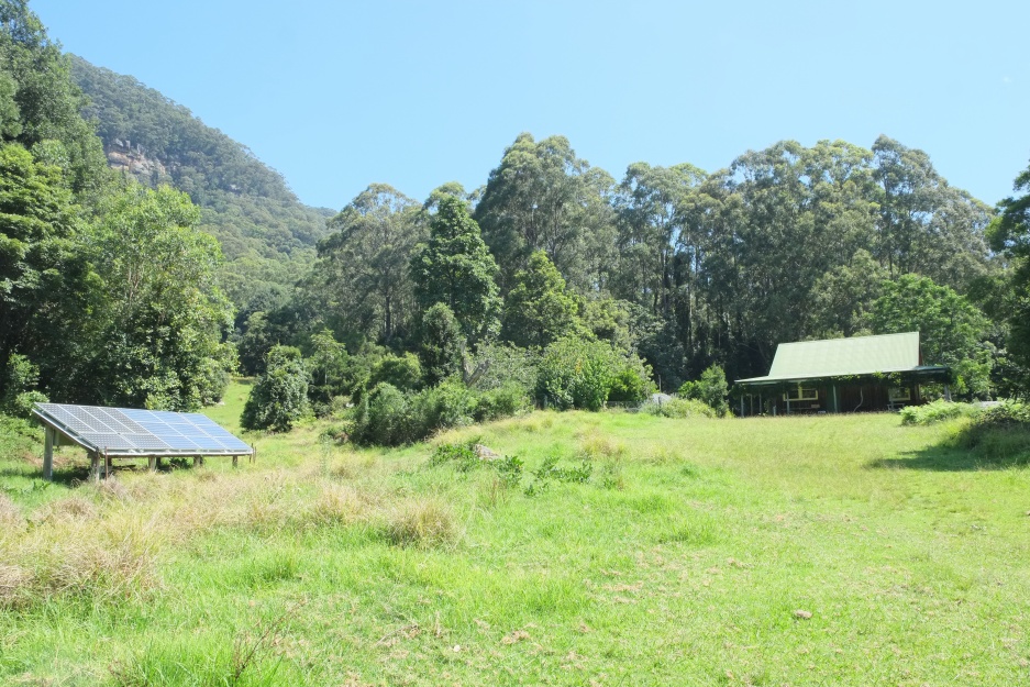 A cottage for guests near the gardens.