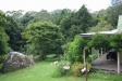 Facing east; the most distant points in the pciture are trees at the top of the cliffs