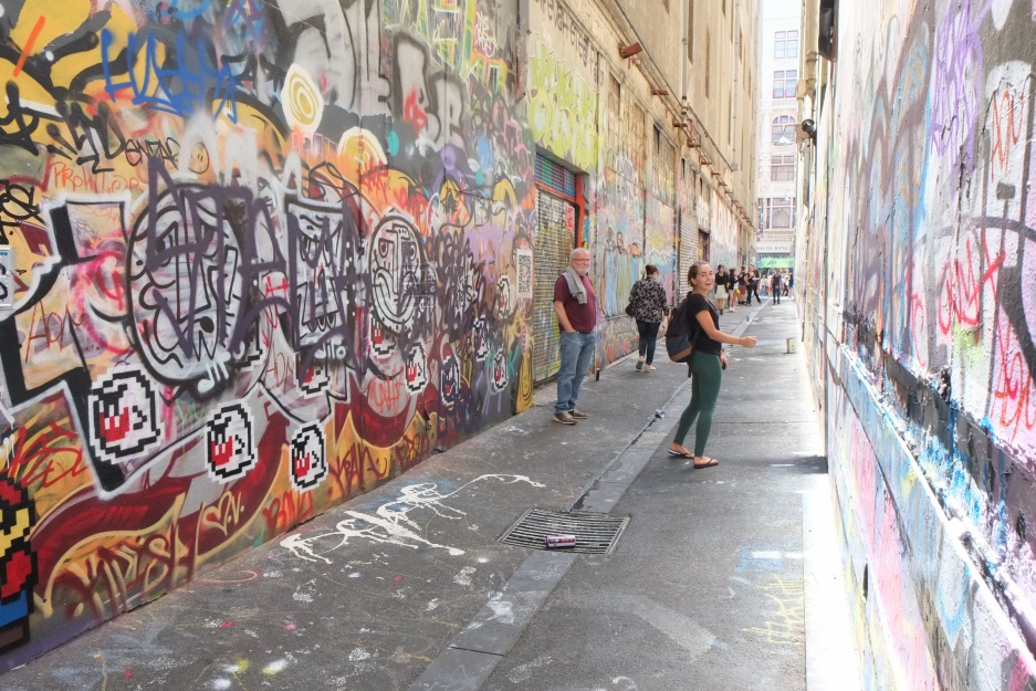 Cam Ford and Gabby in one of the alleyways (possibly Union Lane?) where graffiti artists have a free hand obscuring the drab concrete and brickwork of some downtown Melbourne buildings.