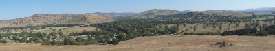 Another view of Gundagai showing the modern highway on the left and two old trestles &8212; one for trains and the others for 19th-century wagons &8212; crossing the often-flooded valley. Prior to the construction of the trestles (apparently the longest of such wooden structures in Australia) a flood would cut off the main transport route between Melbourne and Sydney.